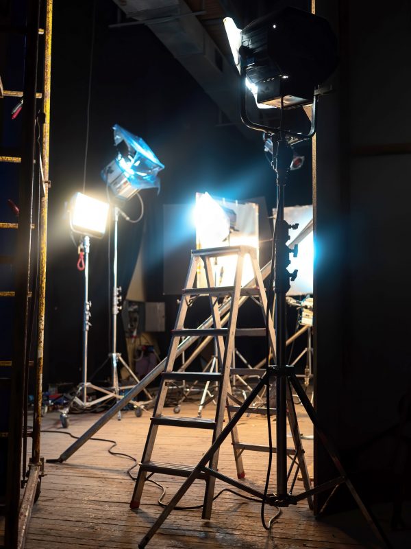 Lots of led lightning systems, few with color filters, stairs on the foreground in pavilion, movie set
