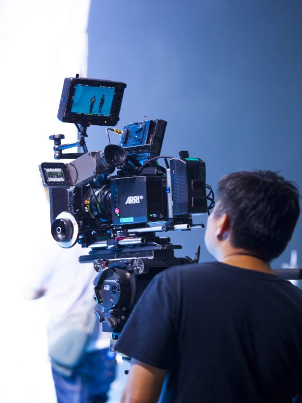 Photographer in studio shooting commercial video