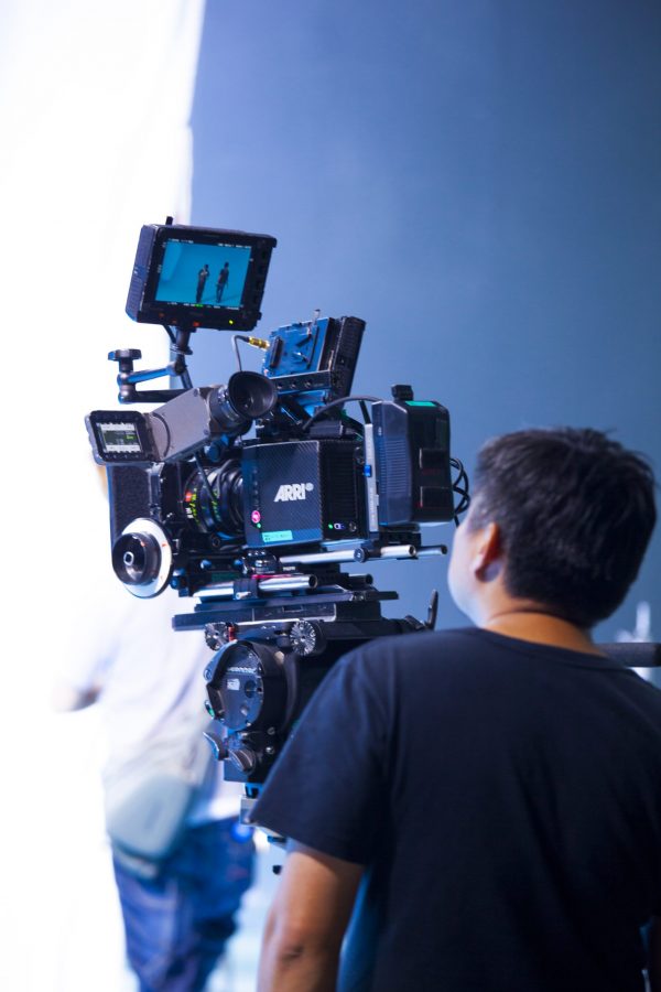 Photographer in studio shooting commercial video